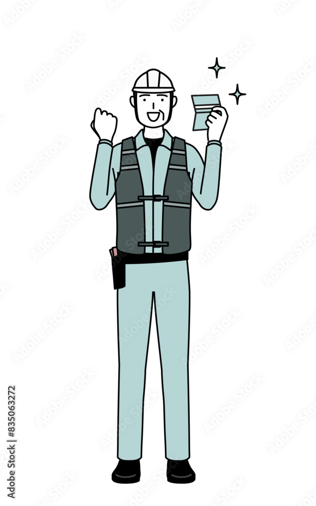 Senior male engineer in helmet and work wear who is pleased to see a bankbook. Senior male engineer in helmet and work wear who is pleased to see a bankbook.