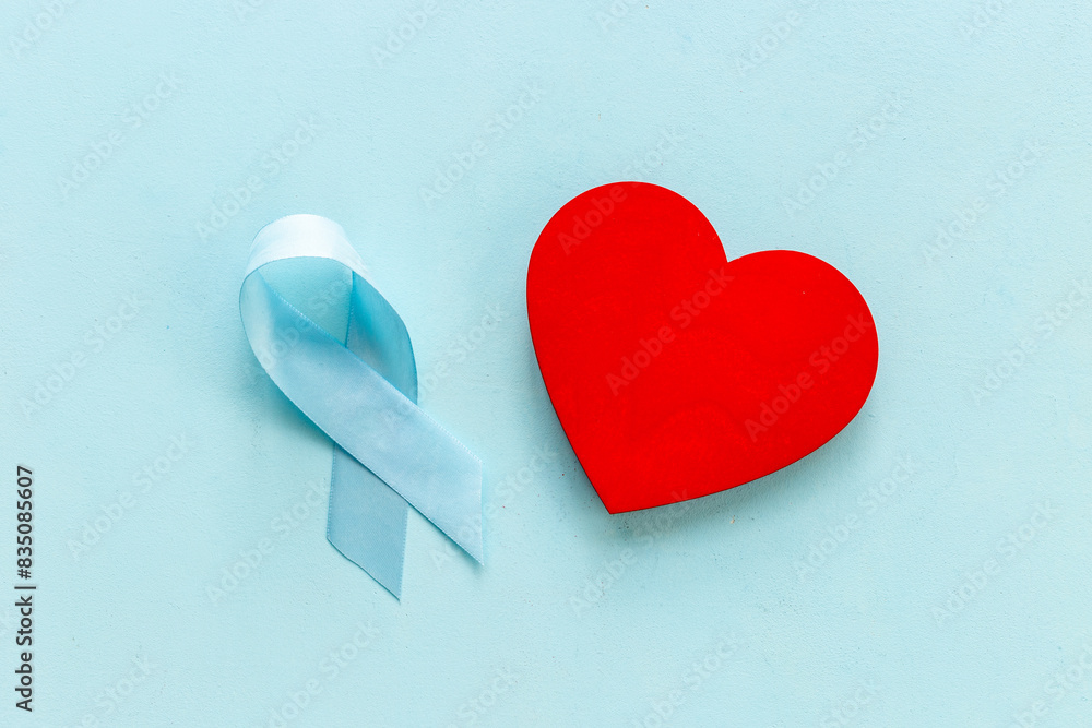 Blue ribbon with heart for world colon cancer day Blue ribbon with heart for world colon cancer day