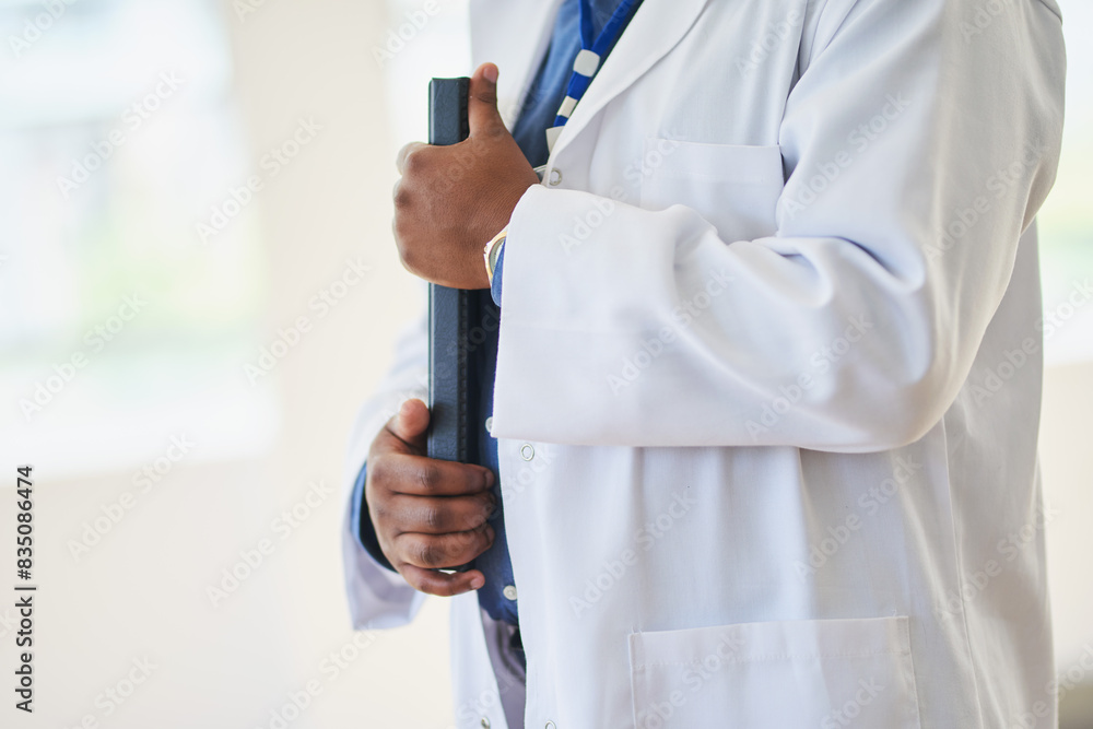 Close-Up of a Doctor Holding Medical Files in a Hospital Close-Up of a Doctor Holding Medical Files in a Hospital