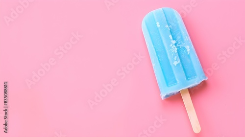 Blue Popsicle on a summery pink Background with Copy Space © drdigitaldesign