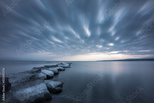 Storm on the lake: the rocks as imperturbable witnesses