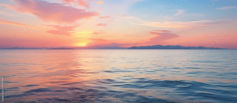 Sunset over the sea with a tranquil tide and a beautiful view in the background with copy space image.