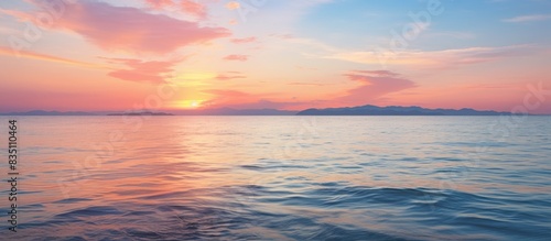 Sunset over the sea with a tranquil tide and a beautiful view in the background with copy space image.