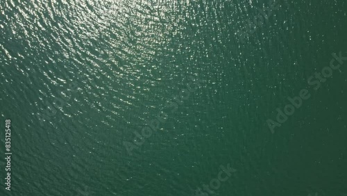 Top-down aerial view of lake water, drone shot directly from above photo