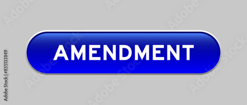 Blue color capsule shape button with word amendment on gray background