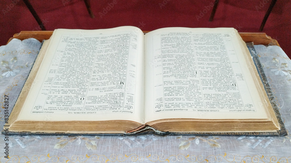 Open new testament bible old book over wooden table Open new testament bible old book over wooden table