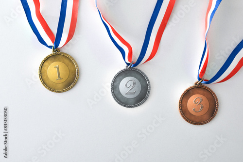 Set of medals with engraved numbers on white background
