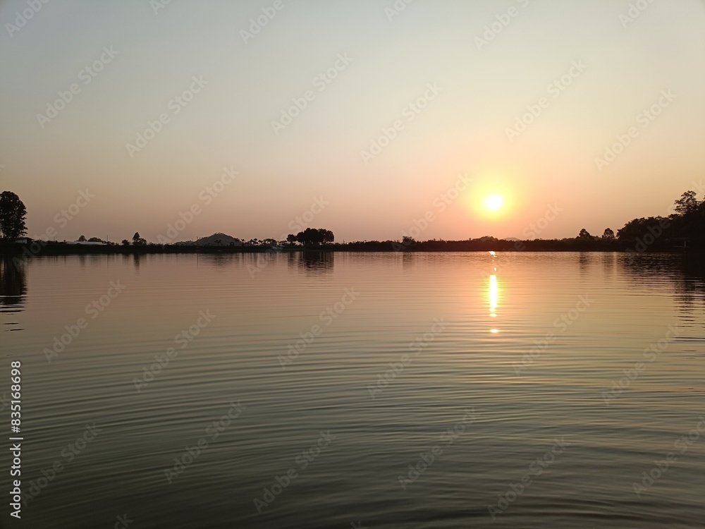 Obraz premium sunset on the river
