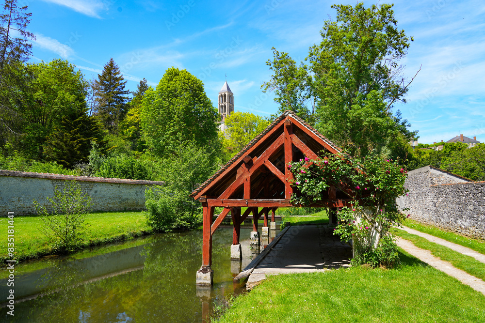 Wash-house along the Fusain river in the Parc de la Tabarderie in Château-Landon, a rural village of the Gâtinais in the French department of Seine-et-Marne, Paris Region, France Wash-house along the Fusain river in the Parc de la Tabarderie in Château-Landon, a rural village of the Gâtinais in the French department of Seine-et-Marne, Paris Region, France