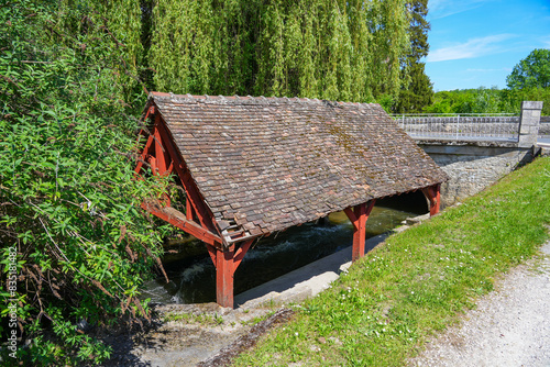 Wash-house along the Fusain river in the Parc de la Tabarderie in Château-Landon, a rural village of the Gâtinais in the French department of Seine-et-Marne, Paris Region, France photo