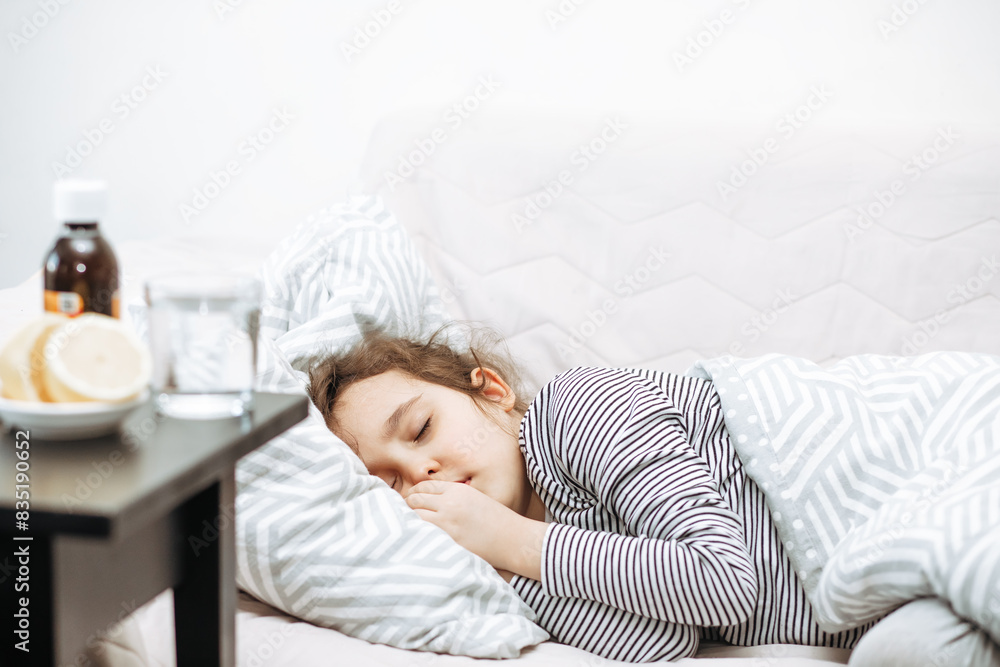 Sick sad little kid girl lies on bed at home. Asthma medicine. Flu season. Healthcare concept. Sick sad little kid girl lies on bed at home. Asthma medicine. Flu season. Healthcare concept.