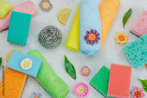 Various sponges for washing dishes. Organic cleaning concept, lemon freshness. Stone background