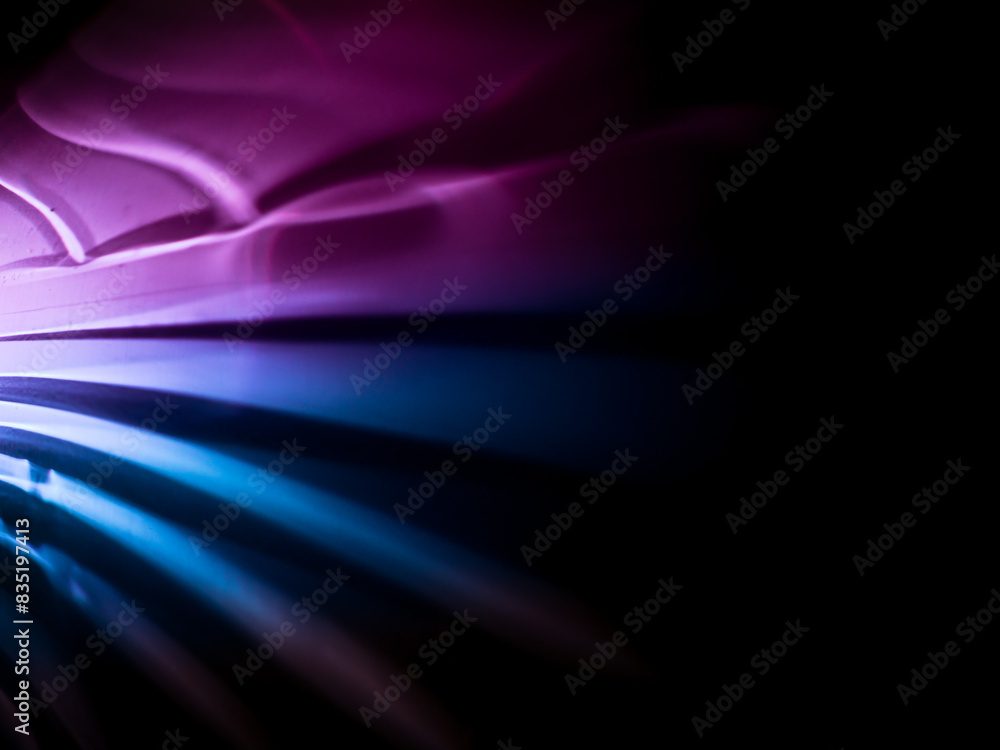 Fototapeta premium Light reflections in dark pink and blue for a magical abstract background. 