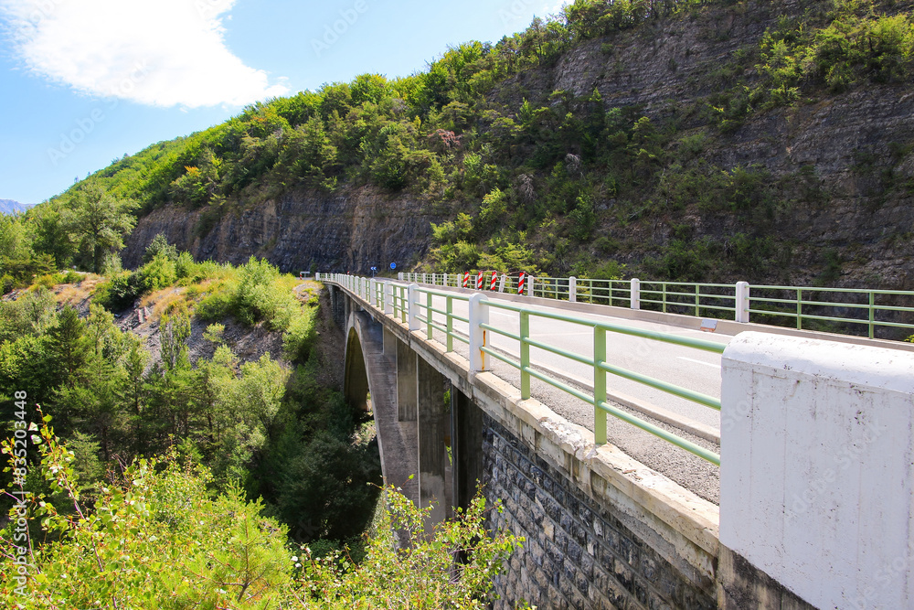 Bridge of Barjavel above the lake of Serre-Ponçon in the French Alps, a dammed artificial reservoir gathering the water of the Durance river Bridge of Barjavel above the lake of Serre-Ponçon in the French Alps, a dammed artificial reservoir gathering the water of the Durance river
