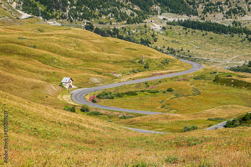 Winding road of the Col du Lautaret, a mountain pass leading up to the Col du Galibier in the French Alps - This is the highest point of the Tour de France photo