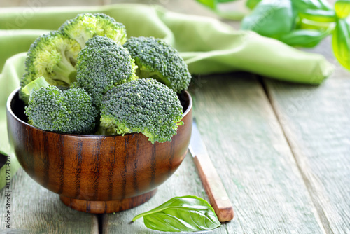 organic broccoli on wooden table healthy eating photo