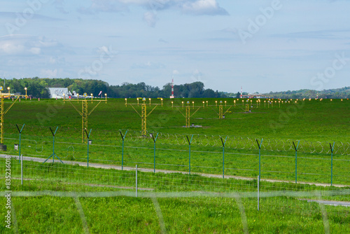 Lampy oświetlające pas startowy na lotnisku |  Lamps illuminating the landing line at the airport photo