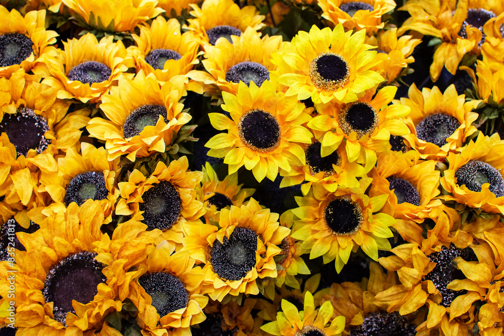 Fototapeta premium Artificial sunflowers in closeup as home decor