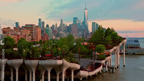 View of Lower Manhattan skyline at dusk, behind the Little Island public park.