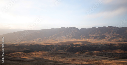 Autumn landscape of vast plains in China. Breathtaking, amazing, endless desert mountain landscapes bordering the Gobi Desert.