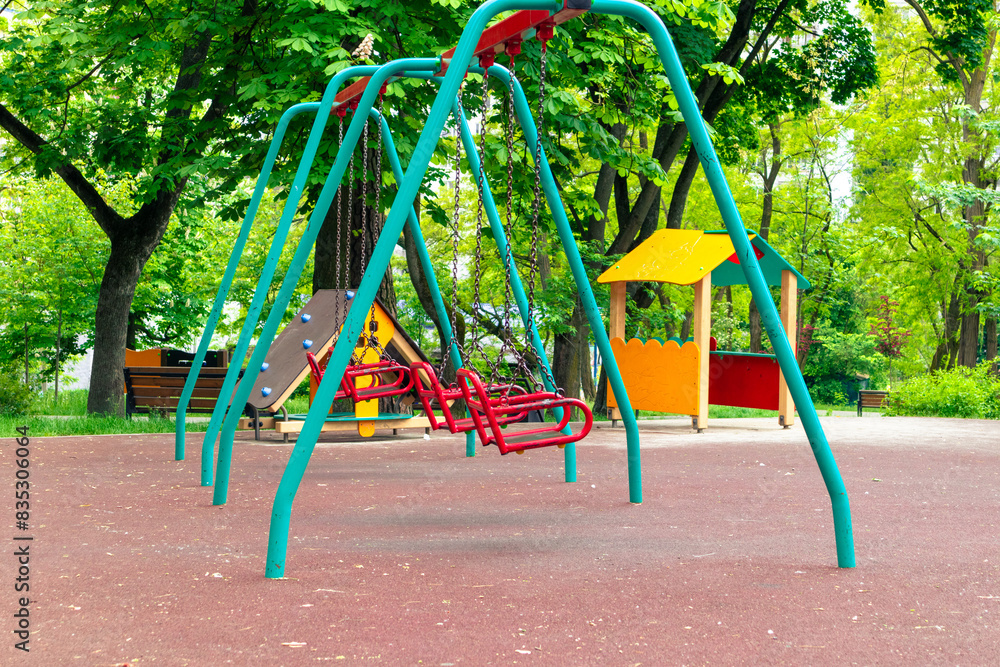 Empty swings on the playground. Empty playground Empty swings on the playground. Empty playground