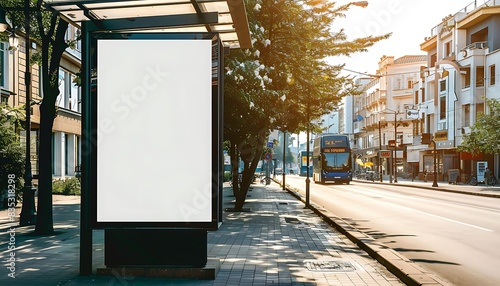 Wallpaper Mural Vertical blank white billboard at bus stop on city street. In the background buildings and road. Mock up. Poster on street next to roadway. Sunny summer day. Torontodigital.ca