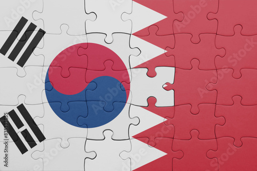 puzzle with the colourful national flag of bahrain and flag of south korea.