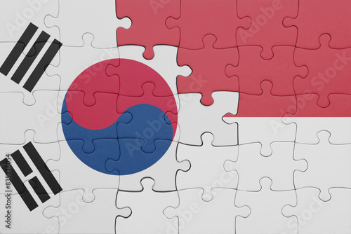 puzzle with the colourful national flag of indonesia and flag of south korea.