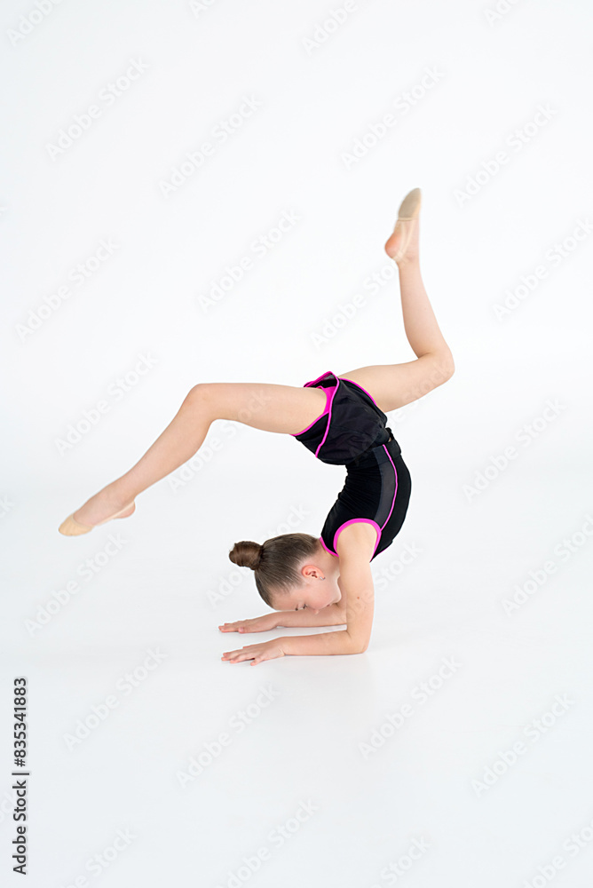 young girl doing gymnastics exercises young girl doing gymnastics exercises