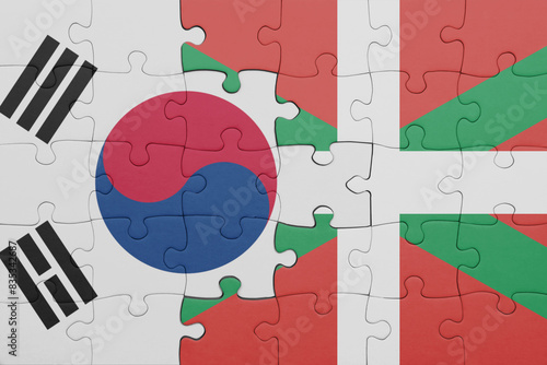 puzzle with the colourful national flag of basque country and flag of south korea.