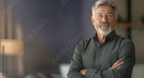 Joyful senior man with gray hair smiling while standing with arms crossed. Concept Portrait Photography, Senior Citizens, Happiness, Smiling, Confidence
