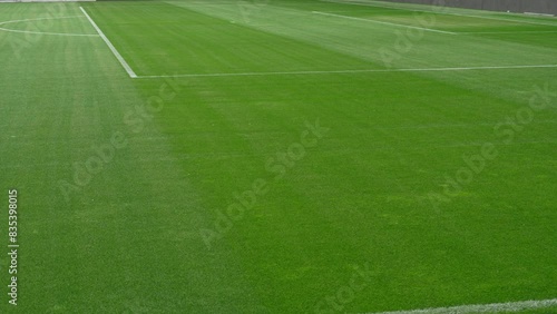 Soccer field stadium or football lawn with green grass, artificial turf panoramic view photo