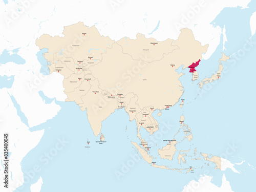 Highlighted red map of NORTH KOREA inside light red detailed political map of Asia using orthographic projection on white and blue background