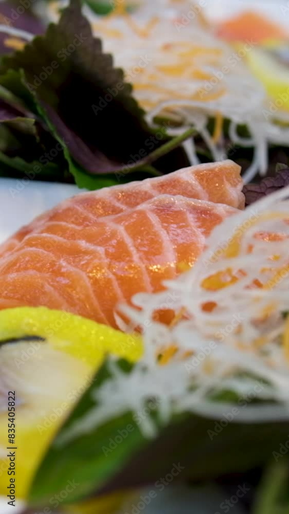 red fish basil sauerkraut and herring on a plate buffet portion serving female hand taking away the plate red fish basil sauerkraut and herring on a plate buffet portion serving female hand taking away the plate
