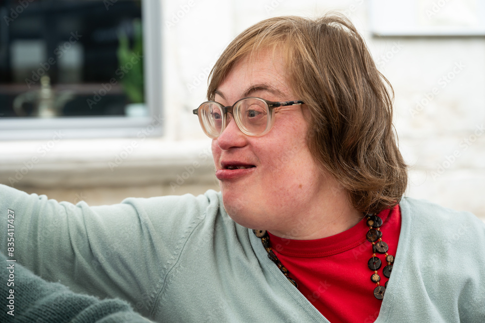 Expressive portrait of a 41 yo woman with the Down Syndrome, Tienen, Flanders, Belgium Expressive portrait of a 41 yo woman with the Down Syndrome, Tienen, Flanders, Belgium
