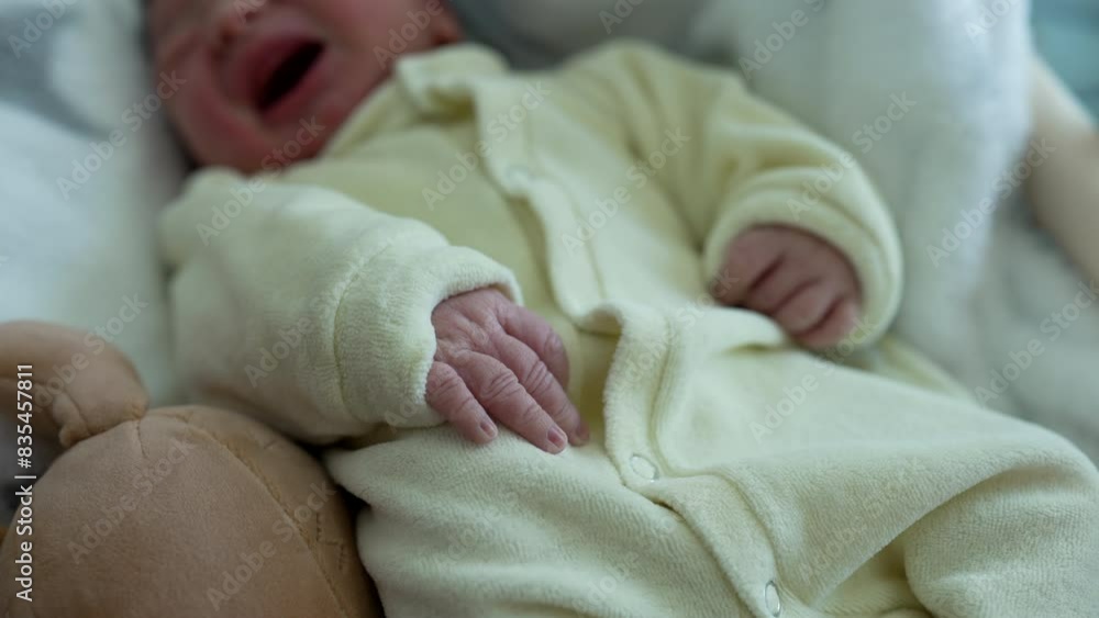 Newborn baby resting in a crib, covered in a soft, white blanket, moving slightly, showcasing the tranquility and comfort of early childhood, and the tender care given to newborns in their first days Newborn baby resting in a crib, covered in a soft, white blanket, moving slightly, showcasing the tranquility and comfort of early childhood, and the tender care given to newborns in their first days