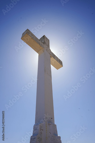 a view of a cross obscuring the Sun