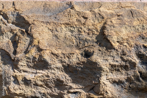 Stony texture of gray cracked wall