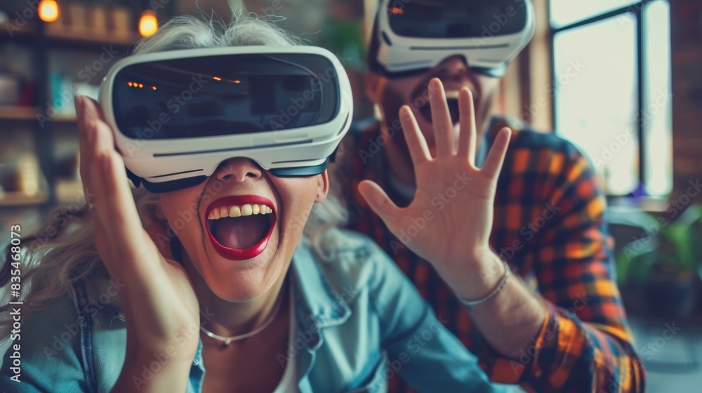 Senior people enjoy virtual world with VR headset on. Senior people enjoy virtual world with VR headset on.
