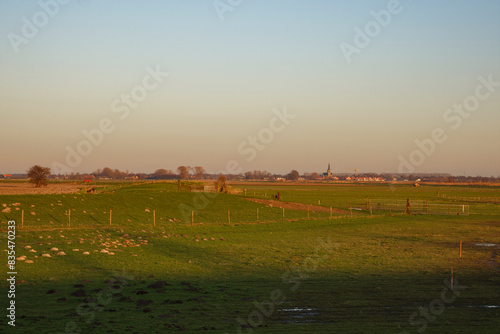 Rural Landscape with Distant Village at Dusk © Marcel Otterspeer