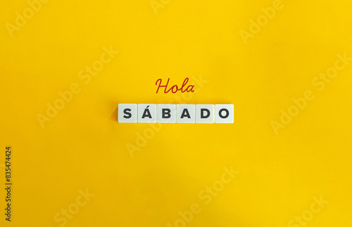 Hola Sábado. Text on Block Letter Tiles on Flat Background. Minimalist Aesthetics. photo