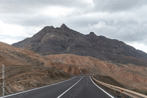 Mountain road on colourful remote basal hills and mountains of Massif of Betancuria  Fuerteventura  Canary islands  Spain