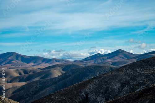 Panoramic view on colourful remote basal hills and mountains of Massif of Betancuria as seen from observation point  Fuerteventura  Canary islands  Spain