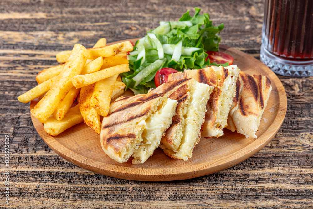 Turkish bazlama toast, plain baked bread toasted. Bazlama, Freshly baked appetizing Turkish tortilla. Pancake toast with cheddar. Turkish bazlama toast, plain baked bread toasted. Bazlama, Freshly baked appetizing Turkish tortilla. Pancake toast with cheddar.