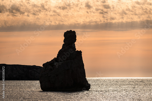 Sunset on Benirras beach in Ibiza in summer. photo