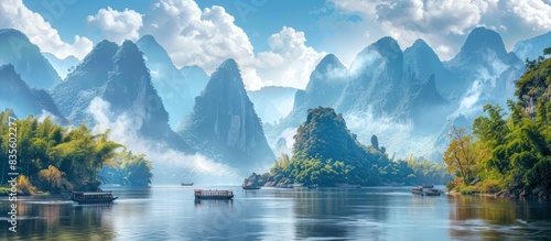 A serene scene of the Yangtze River, with its majestic mountains and lush greenery in, China.  photo