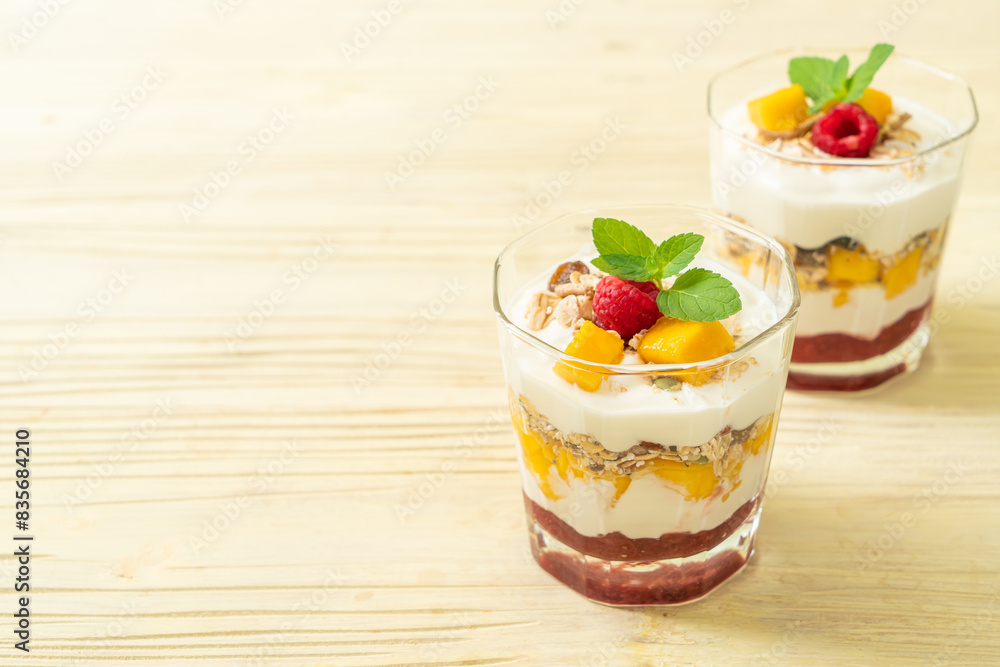 homemade mango and raspberry with yogurt and granola homemade mango and raspberry with yogurt and granola