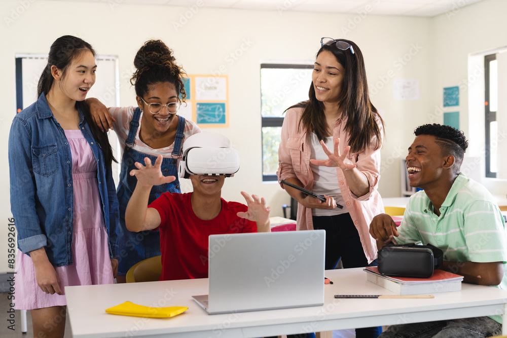 Diverse students explore virtual reality in a classroom in high school Diverse students explore virtual reality in a classroom in high school