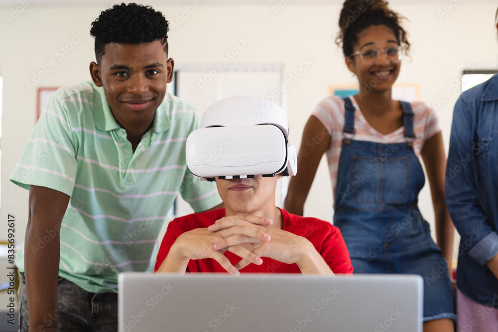 © Wavebreak Media - Teenage biracial boys and teenage girls in a classroom in high school
