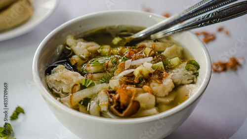 A luxurious and close-up shot of a bowl of tekwan photo